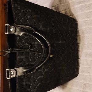 Kate Spade Black quilted body with leather straps and ties. Great used condition